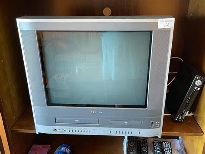 How do I eject a DVD from my Toshiba TV?